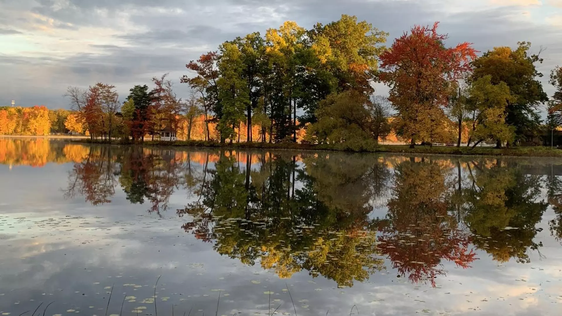 Little Paw Paw Lake in the Fall with reflection of colorful leaves on the lake